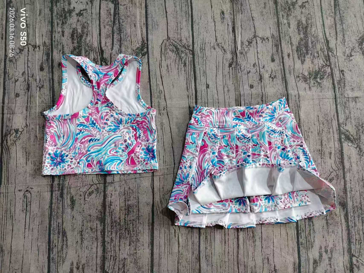 Blue fuchsia swirl printed top and skort.