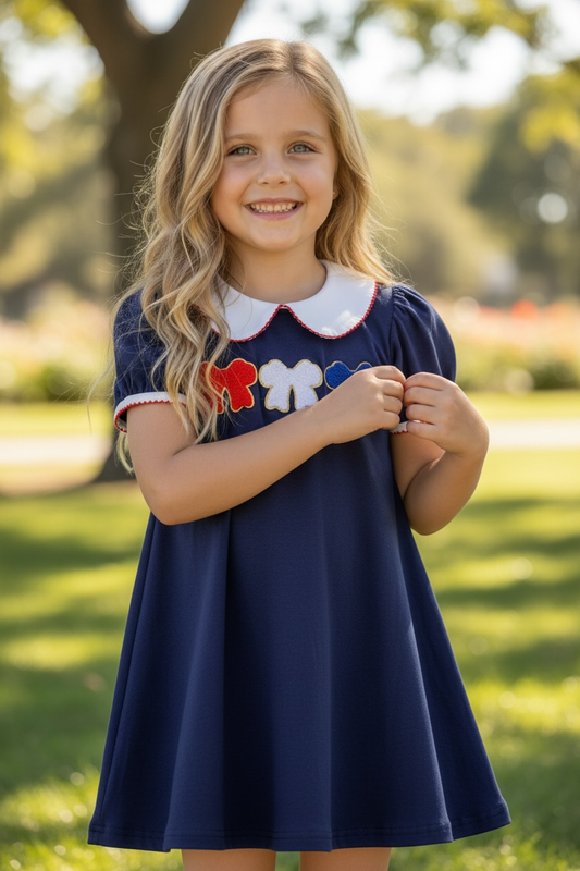 Bow applique on navy blue dress. DRG60697 Jean