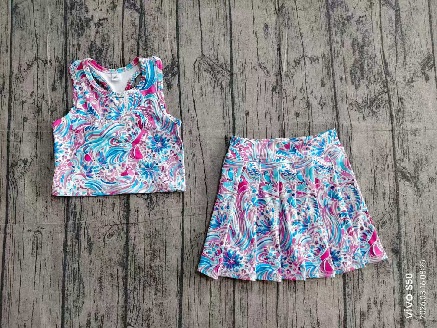 Blue fuchsia swirl printed top and skort.